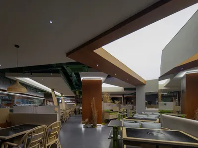 A modern restaurant with timber and concrete interior design elements.
