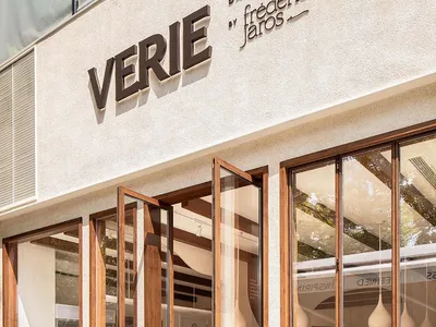 Modern minimalist restaurant exterior with wooden materials and large glass windows