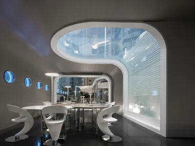 A modern restaurant with glass walls and visible cityscape through the windows.