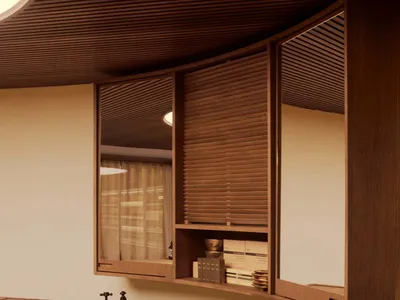 A modern kitchen with wooden cabinets and countertops, featuring a double sink and a shelf with storage items.