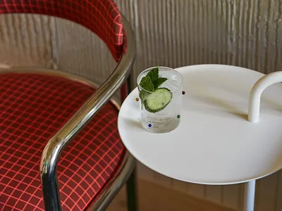 Modern interior of a restaurant featuring a glass cocktail.