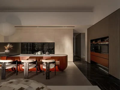 A modern kitchen featuring marble countertops, metal appliances, and wooden cabinets.