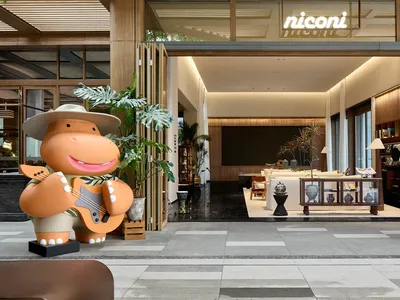 A modern hotel lobby featuring wooden elements.