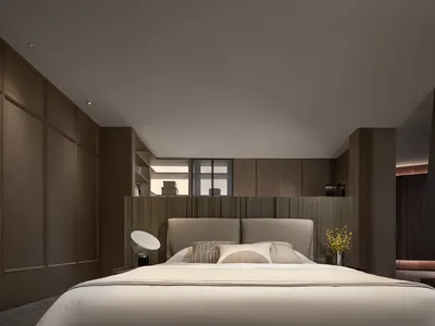 Minimalist bedroom featuring a headboard with a neutral color palette and simple design.