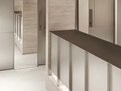 Interior view of a modern restaurant featuring concrete walls and flooring.