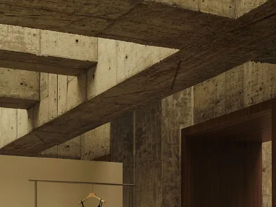 A retail space with concrete walls and a minimalist design.