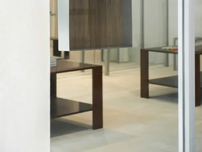 A modern restaurant interior featuring a metal and wood menu board with the text 'The Menu'.