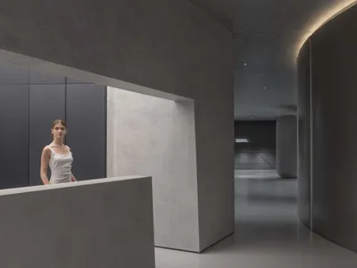 Modern hotel hallway with minimalist design and concrete materials
