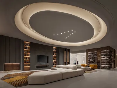 Modern industrial living room with metallic accents, featuring a futuristic ceiling and contemporary furniture.