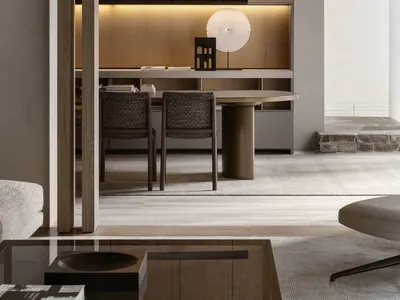 A modern home office with wooden furniture and floor-to-ceiling shelves.