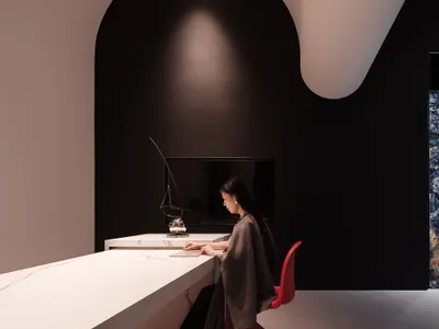 A minimalist interior design featuring a modern bar counter made of marble.