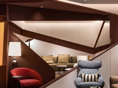 An industrial-style living room with metal accents and a mix of modern and vintage furniture.