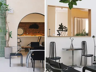 Interior design of a modern restaurant featuring glass, leather, and brick materials.