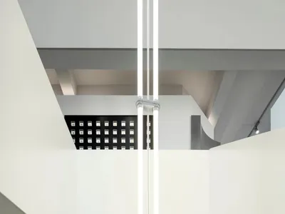 Modern hotel suite featuring glass walls and concrete floor