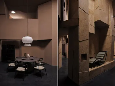 A modern restaurant interior with a circular table, white pendant lamp, and concrete walls.