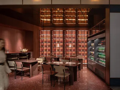 Modern interior design of a restaurant-bar with metallic and glass elements.