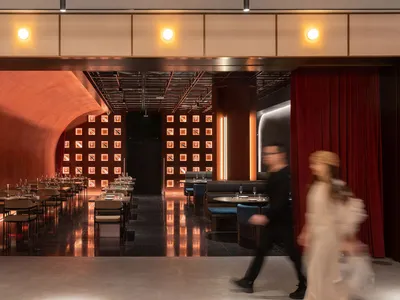 A modern restaurant interior with metallic textured walls