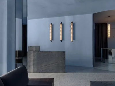 Modern hotel lobby featuring marble finishes and minimalist design.