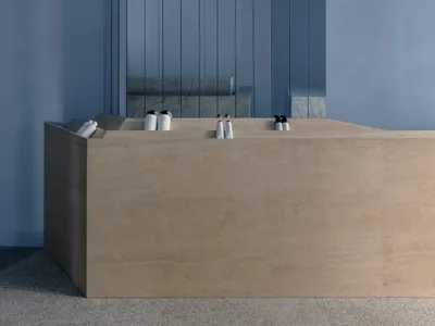 Modern hotel reception desk made of concrete.