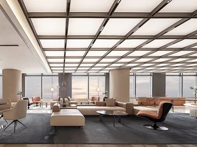 A spacious, modern hotel lobby featuring steel, leather, and glass materials.