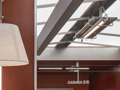 A modern restaurant checkout area with wooden surfaces and sleek design.