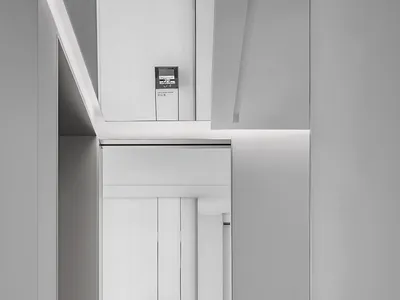 Minimalist hospitality interior featuring sleek, neutral-colored design elements.