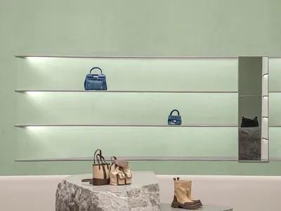 A retail storefront with a concrete base and minimalist design.