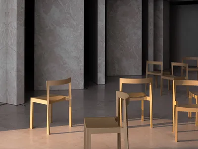 Modern restaurant interior with gray marble walls and concrete columns