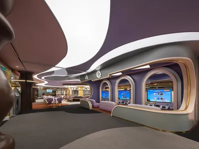 Interior view of a modern restaurant featuring metallic finishes, curved glass panels, and geometric shapes.