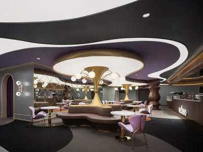 Modern restaurant interior with metal lighting fixtures and contemporary furniture.