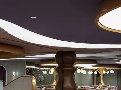 A modern restaurant with metallic furniture and walls.