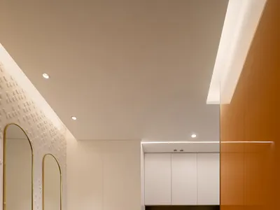 A modern home office with white walls and minimalist design.