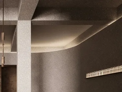 A modern restaurant entryway featuring a concrete design.
