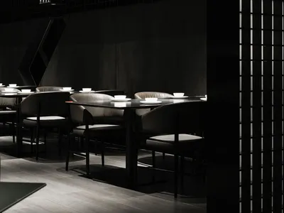 Modern restaurant interior with black metal cubes on the ceiling