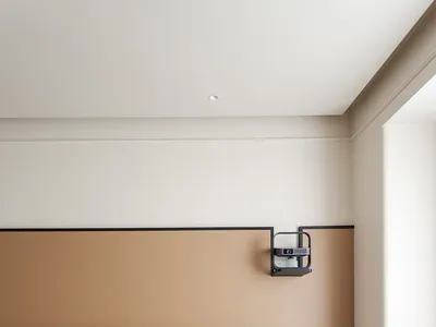 Minimalist bedroom with a blend of materials including fabric, wood, metal, and leather.