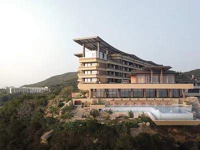 山區現代酒店度假村，混凝土與玻璃外觀