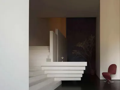 Modern hotel lobby with white marble reception desk and minimalist design