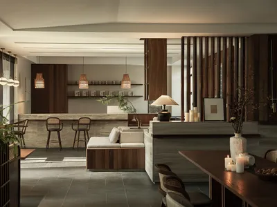 A minimalist hotel interior with marble and wooden elements.