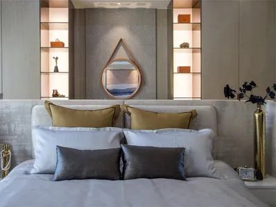 Modern minimalist bedroom featuring fabric, leather, glass, and metal elements