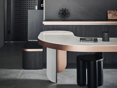 A modern kitchen featuring metallics and marble