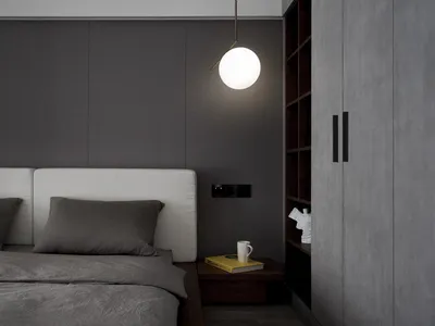 Minimalist bedroom featuring fabric headboard, wooden bed frame, and concrete wall