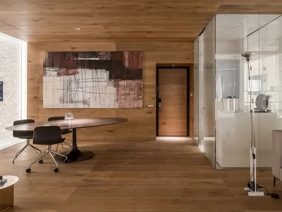 Modern bathroom interior with wooden flooring and minimalist design.