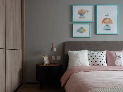 Modern, minimalist bedroom featuring a bed with a wooden headboard and pink bedding, accompanied by a black nightstand and a