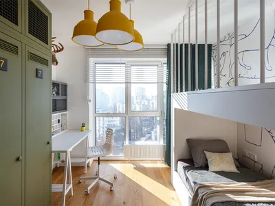 Modern child room with wooden floors, metal bunk bed, and fabric bedding.