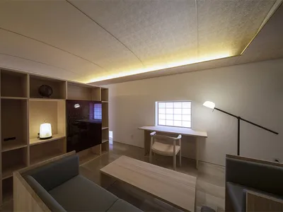An industrial-style living room with metal furniture and minimalist design.