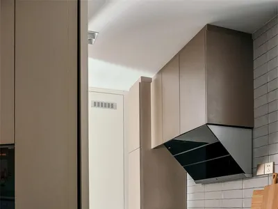 Modern kitchen featuring stone countertops and cabinets.