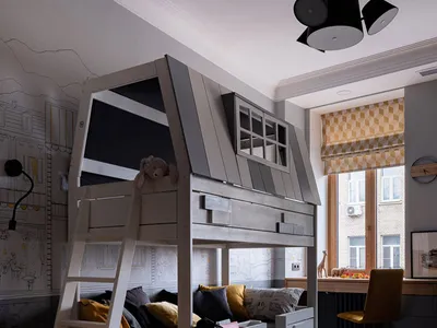 Modern children's bedroom featuring a bunk bed with a timber design, brightly colored textiles, and a yellow bean bag chair.