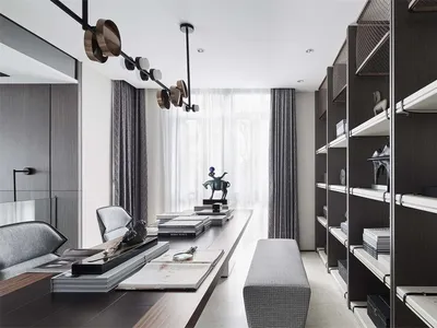 A modern, minimalist home office featuring black metallic accents and organized shelves.