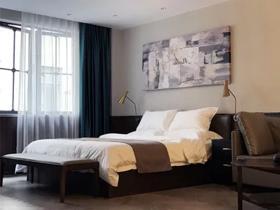 A modern bedroom with a brown bed in a minimalist style