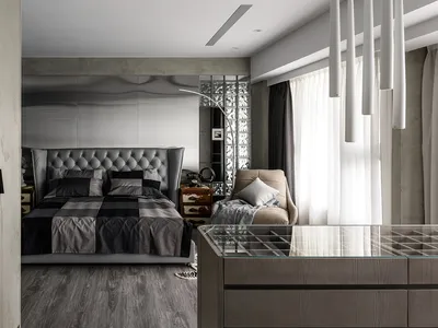A modern minimalist bedroom featuring a faux leather bed frame and marble accents.